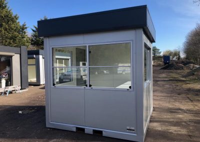 Security kiosk 240cm x 220cm (8ft x 7ft6in) price includes: electrical installation, wall-mounted electric heater, under window counter and advertising header