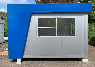 Perfect Kiosks- Security Kiosk 360cm x 240cm (12ft x 8ft) price includes: electrical installation, wall-mounted electric heater, under window counter and advertising header