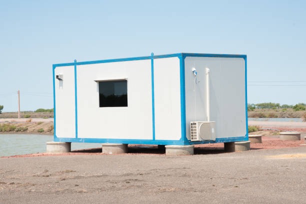 Portable Office with wooden cladding 600cm x 300cm (10ft x20ft) – Model 3 – Steel frame 80x80x3 mm; Galvanized steel; Roof, walls and floor insulated with 100mm Styrofoam; Aluminum double glazed: door, PVC opening window and 4 PVC fix windows;